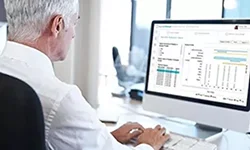 Man looking at clinical data 